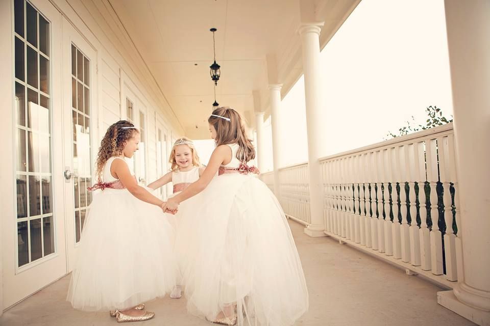 Ballerina style flower girl dress with a very full tulle skirt in ivory and white