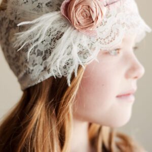 A photo of a lace flower girl headband with roses