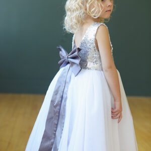 A Photo of a flower girl wearing a sequin and tulle dress