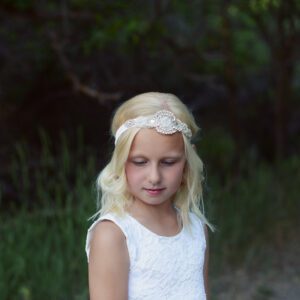 A photo of the Natasha Flower Girl Headband which is an elasticated headband suitable for all head sizes. The headband has a diamante motif and is perfect for flower girls