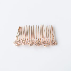 A photo of a rose gold bridal hair comb