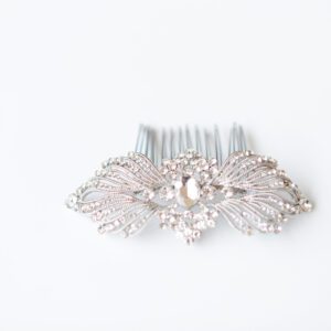 A photo of a silver bridal hair comb in an art deco style