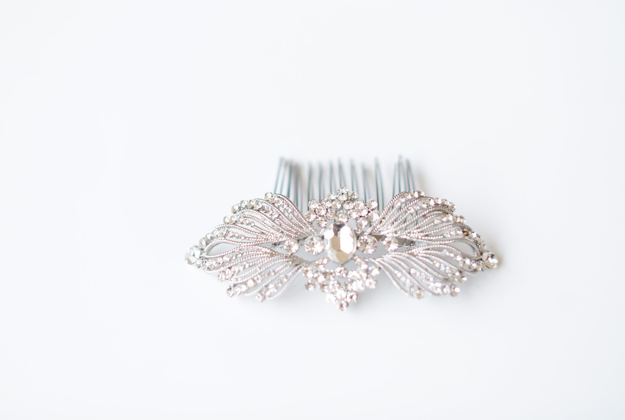 A photo of a silver bridal hair comb in an art deco style