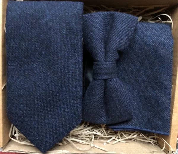 A photo of a navy wool tie, bow tie and pocket square ideal as groomsmen gifts and comes with free gift wrapping