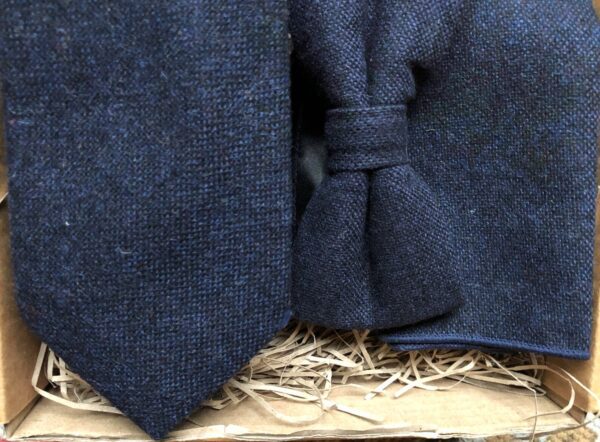 A photo of a navy wool tie, bow tie and pocket square ideal as groomsmen gifts and comes with free gift wrapping