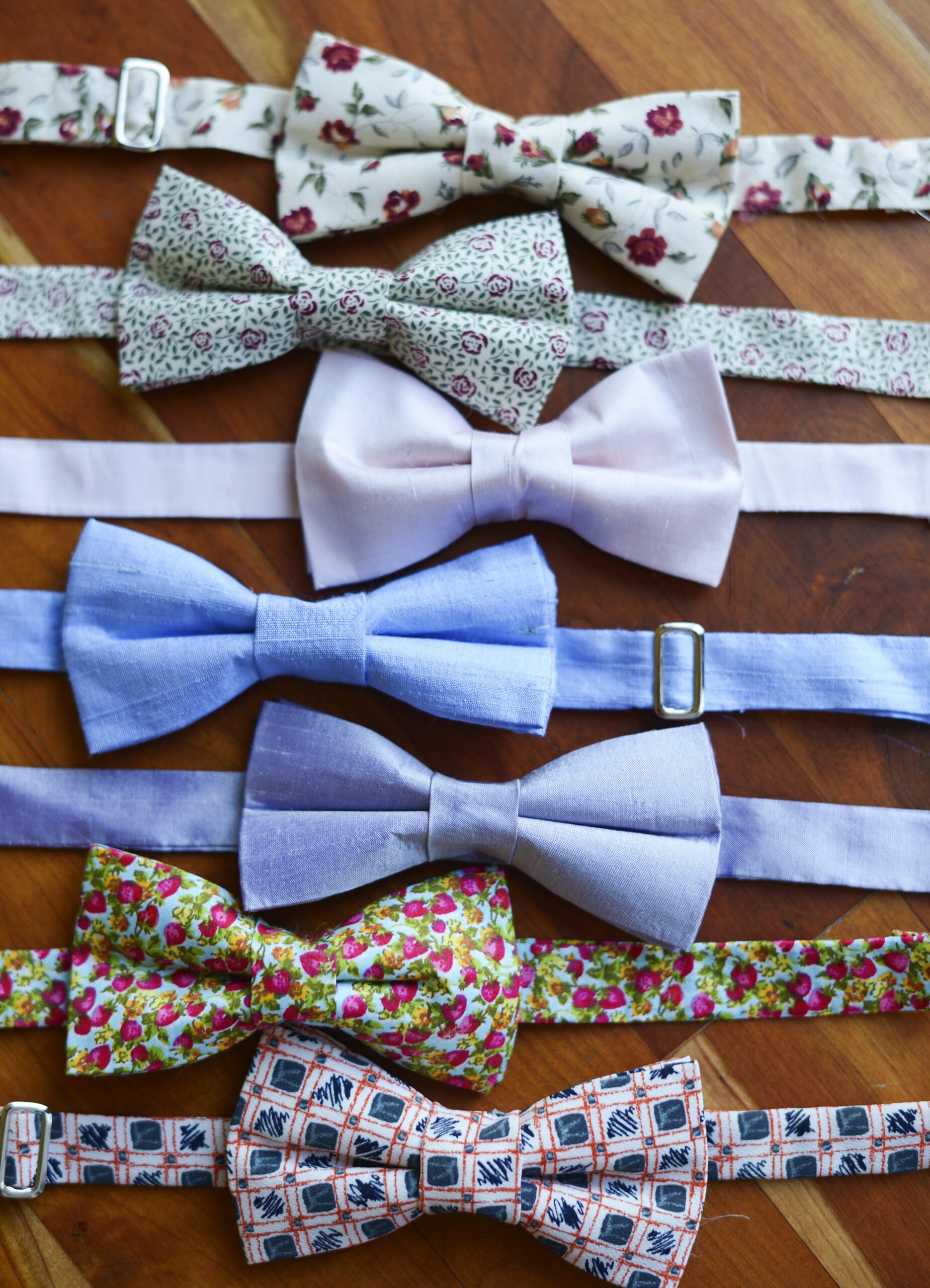 A photo of a range of bow ties in different floral patterns
