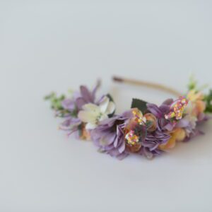 A photo of a purple floral headband for flower girls