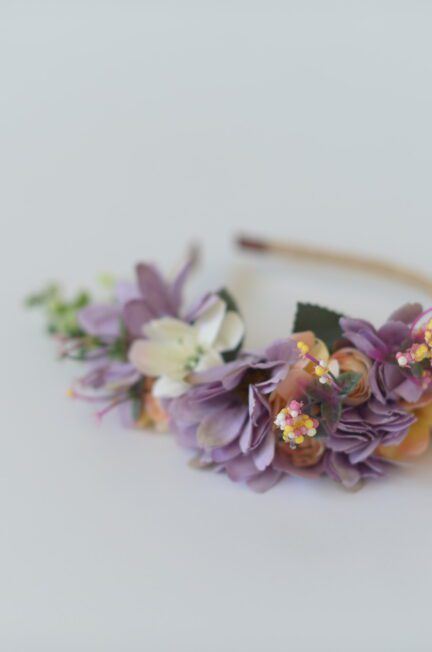 A photo of a purple floral headband for flower girls