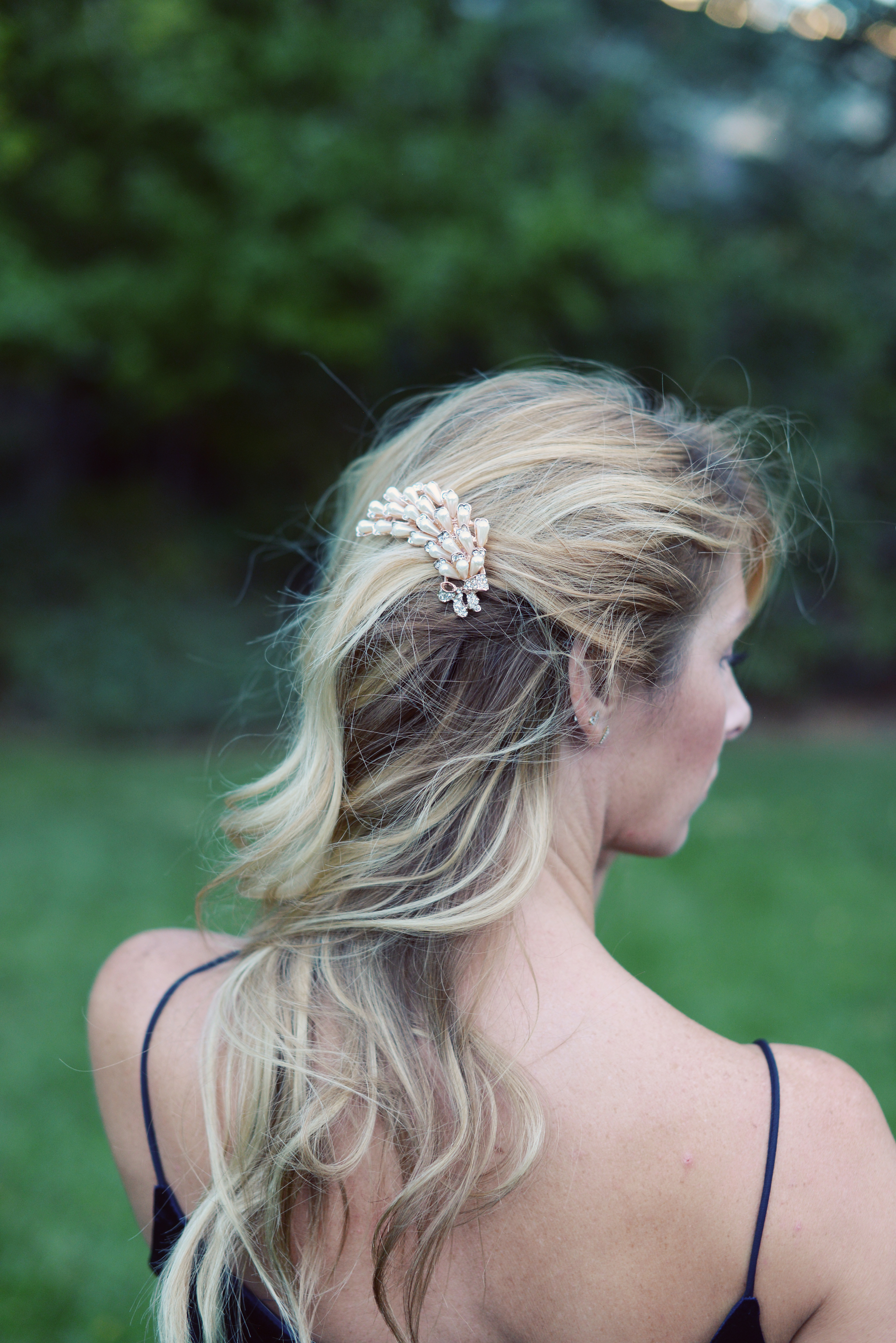 Bride wearing a rose gold and pearl hair comb