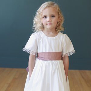 Ivory cotton flower girl dress with lace collar and pink sash