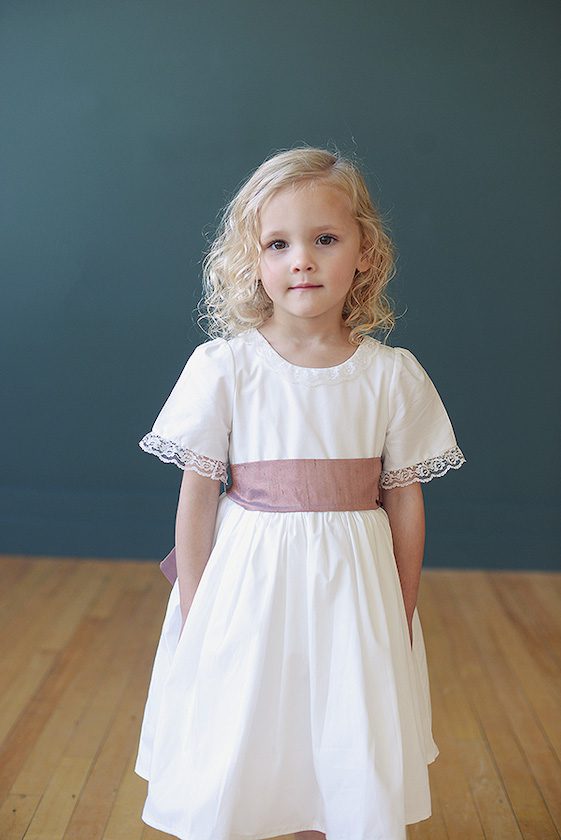 Ivory cotton flower girl dress with lace collar and pink sash