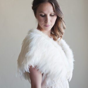 A photo of a feathered wedding shawl in ivory or white