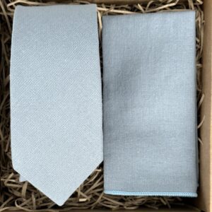 A photo of a duck egg blue men's tie and pocket square in cotton