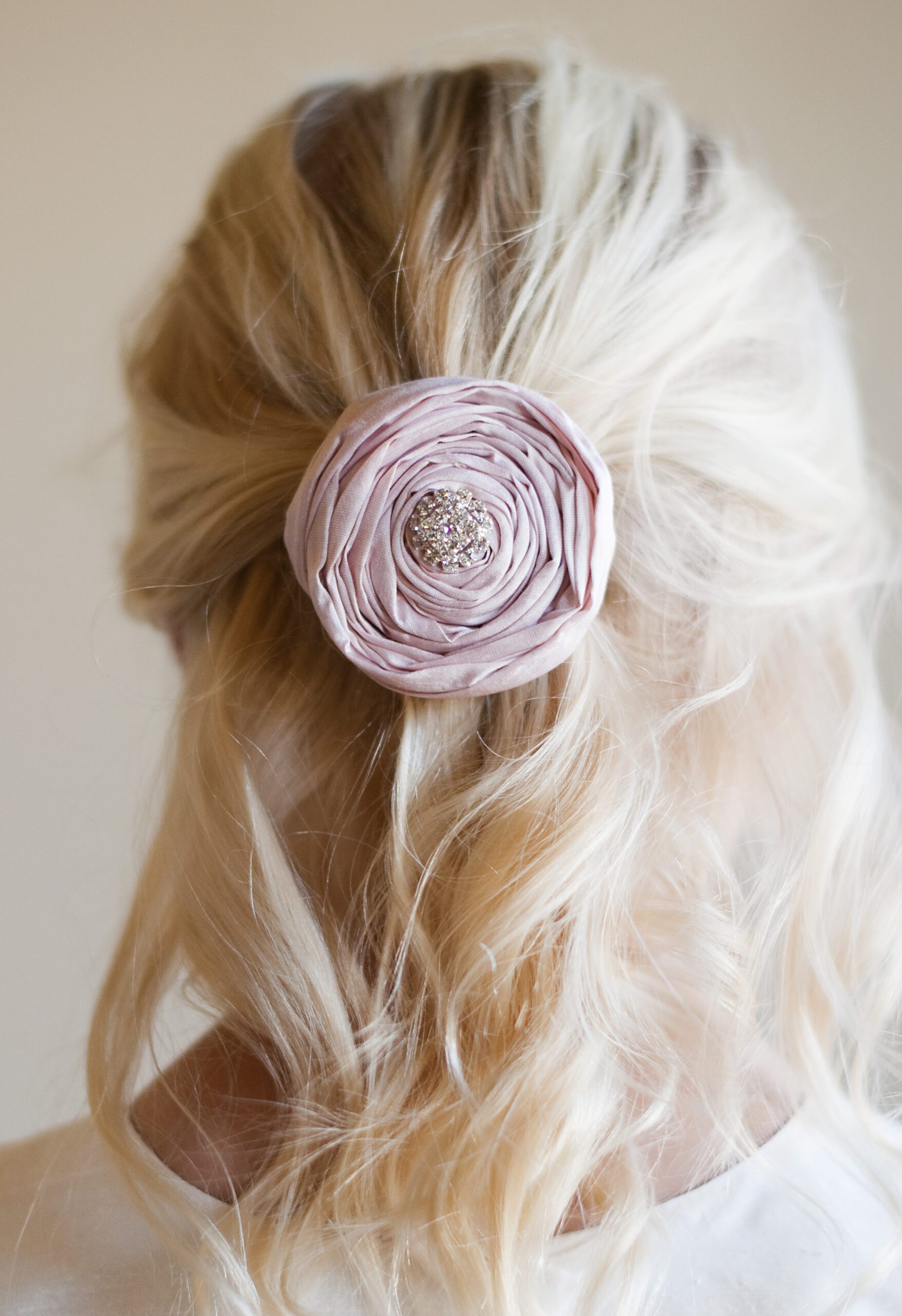 A photo of a blush pink silk rose for flower girls