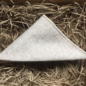 A photo of a cream wool pocket square for men's suits