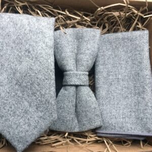 A photo of a grey wool tie, bow tie and pocket square in wool ideal for grooms and groomsmen