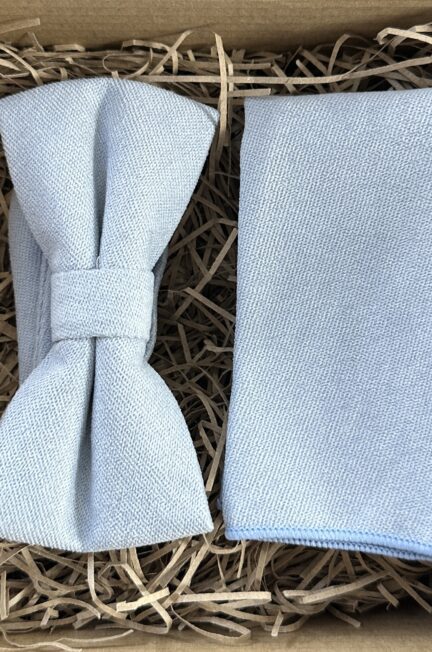 A photo of a light blue brushed cotton bow tie and pocket square for weddings