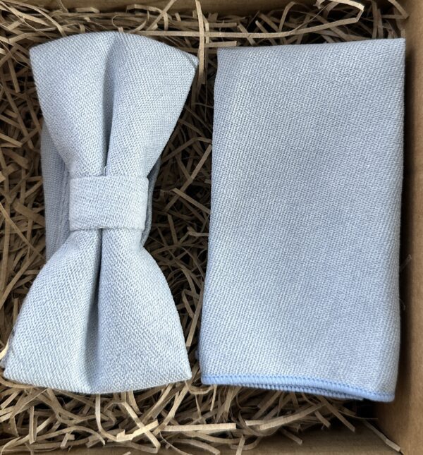 A photo of a light blue brushed cotton bow tie and pocket square for weddings