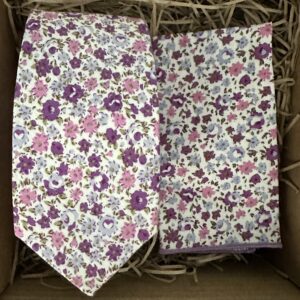 A photo of a floral lavender tie and pocket square in cotton for weddings