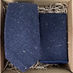 A photo of a navy blue flecked wool tie and pocket square for men and as men's gifts