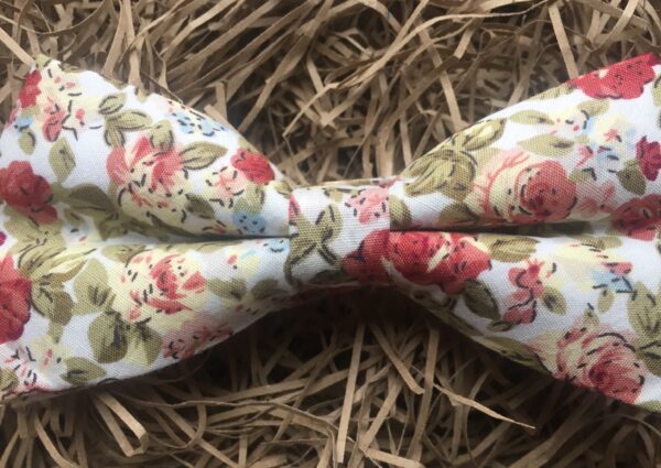 A photo of a pink rose bow tie for weddings