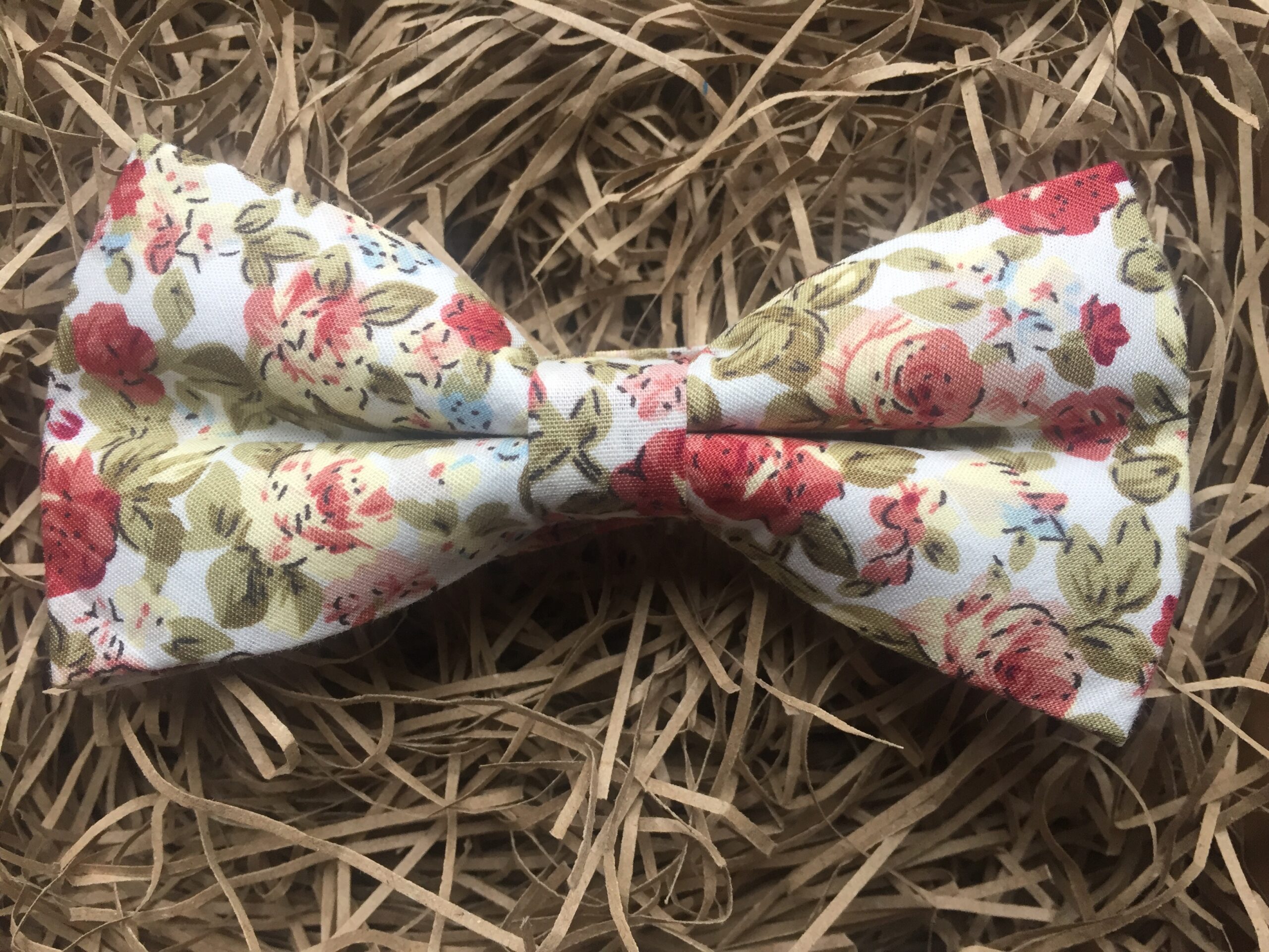 A photo of a pink rose bow tie for weddings
