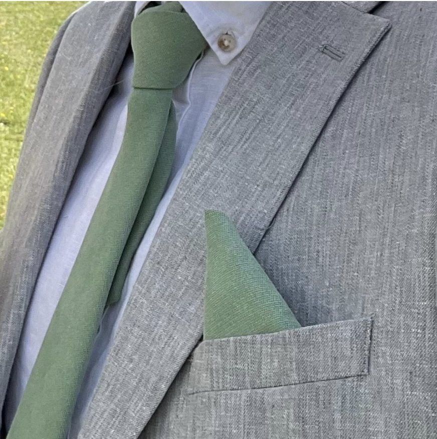 A mans tie and pocket square set in sage green brushed cotton for weddings.