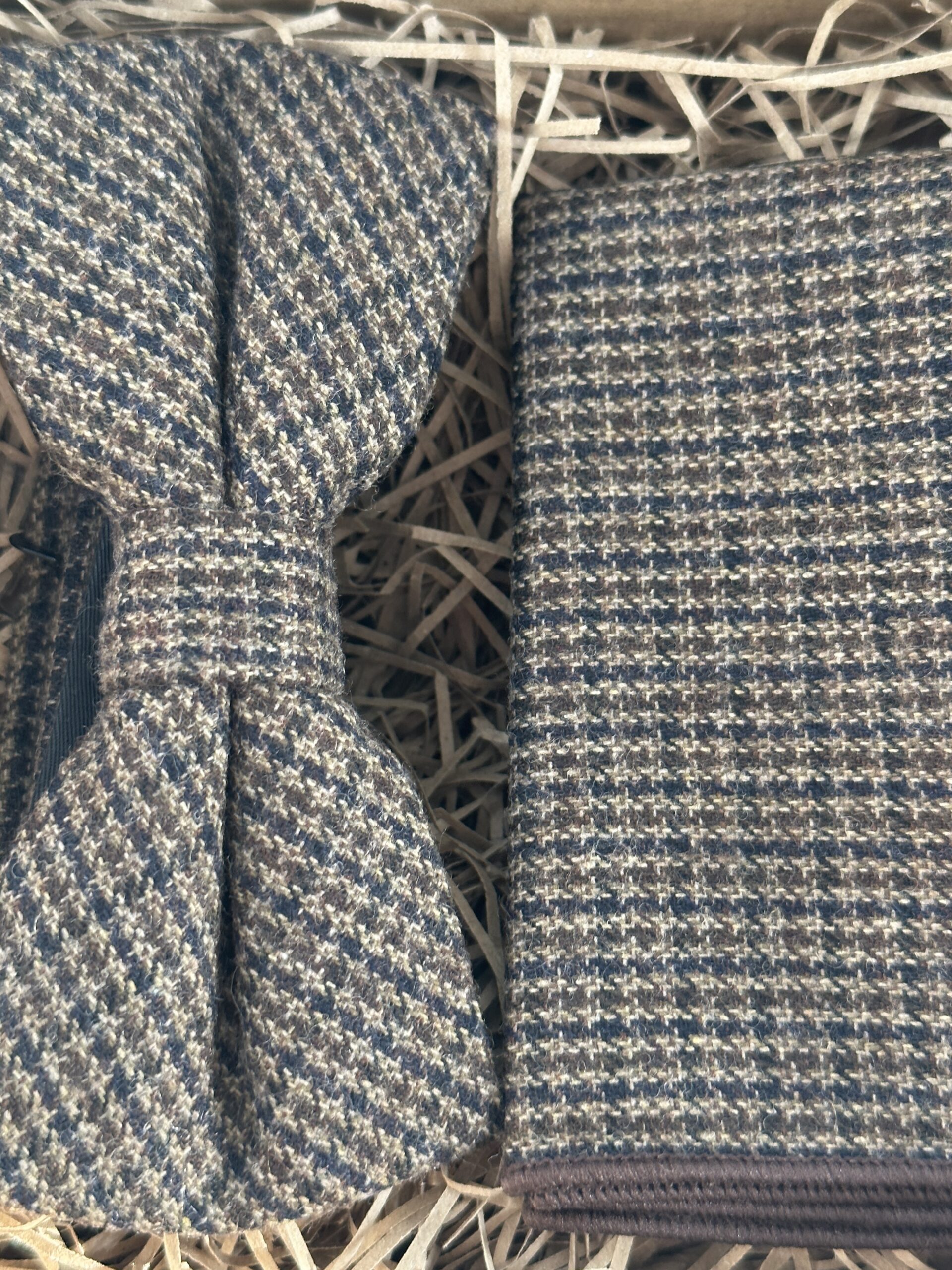 A photo of a brown checked hounds tooth bow tie and pocket square in wool