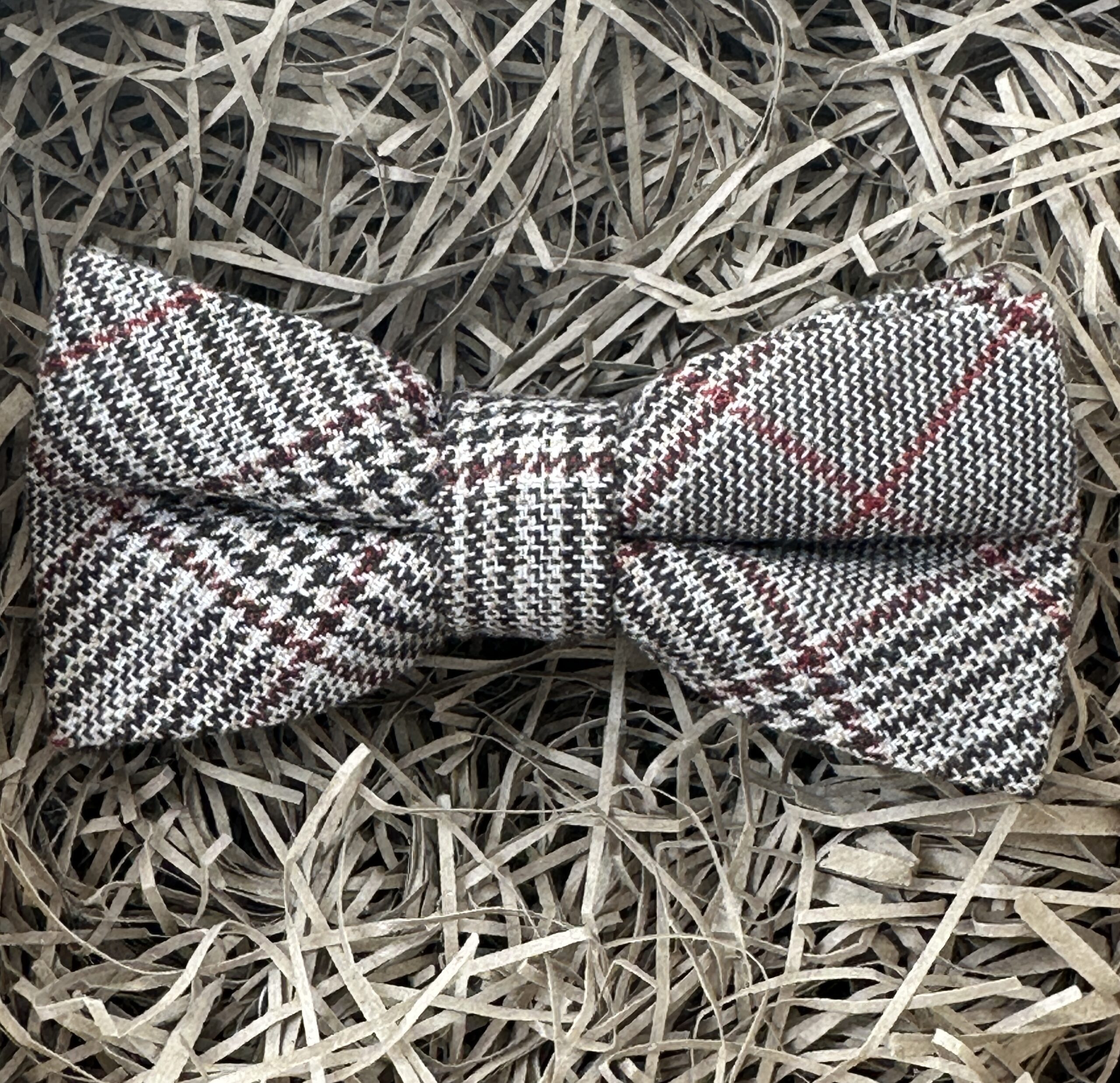 A photo of a brown striped bow tie