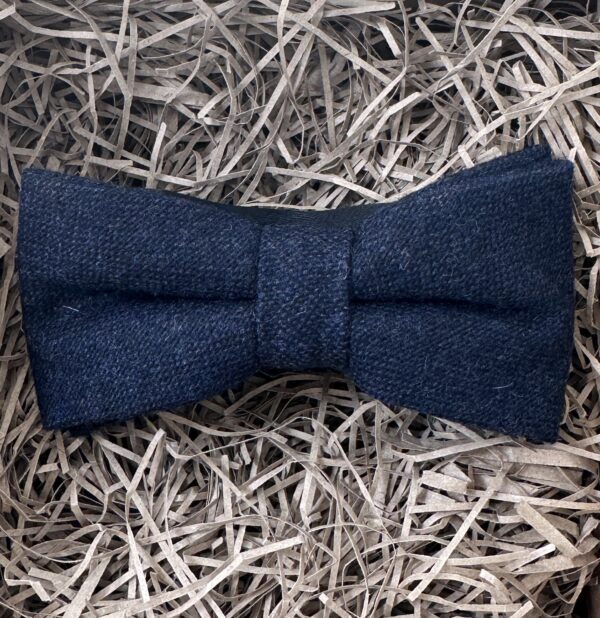 A photo of a navy wool bow tie