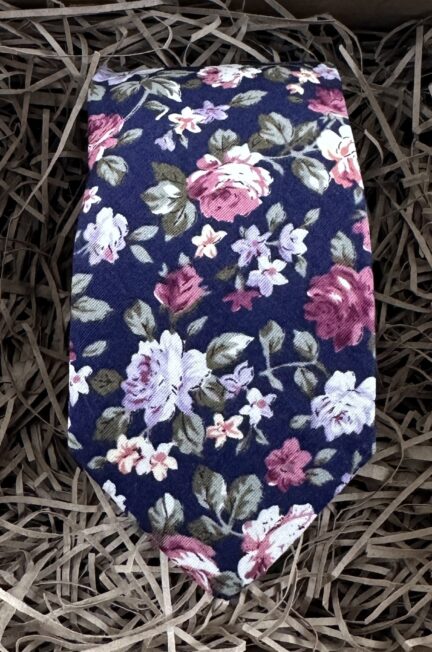 A photo of a blue rose floral tie in cotton