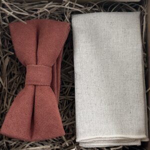 A photo of a terracotta bow tied and flax linen pocket square