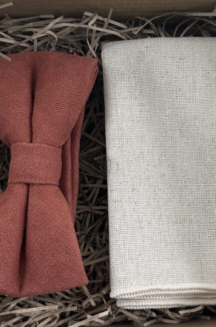 A photo of a terracotta bow tied and flax linen pocket square