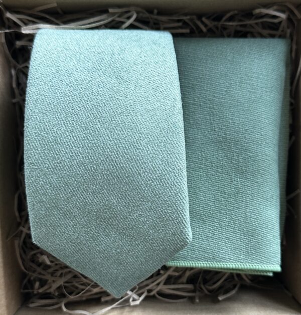 A photo of a silvery green men's cotton tie and pocket square set