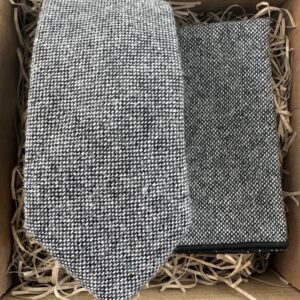 A photo of a grey flecked wool tie and pocket square set