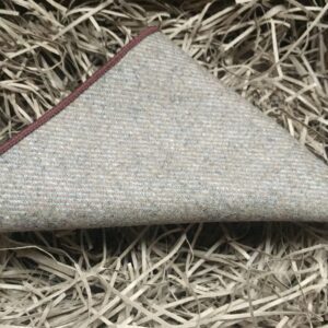 A photo of a beige wool pocket square with a textured effect