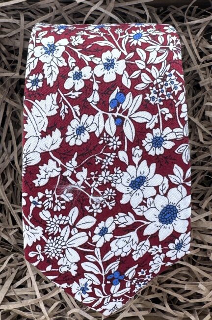 A photo of a red floral cotton tie
