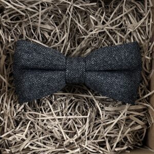A photo of a dark grey flecked wool bow tie