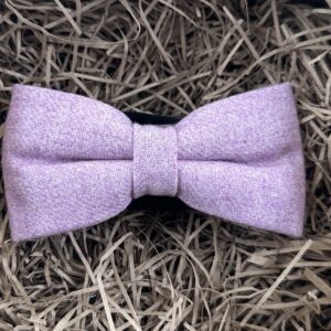 A photo of a lilac wool, pre-tied bow tie