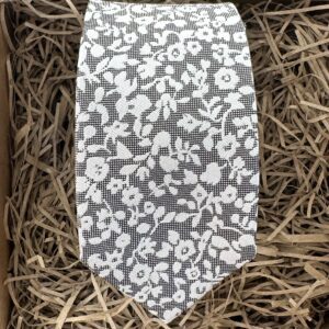 A photo of a silver grey mens floral tie 6cm wide