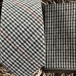 A photo of a check tie and pocket square ideal for a vintage style