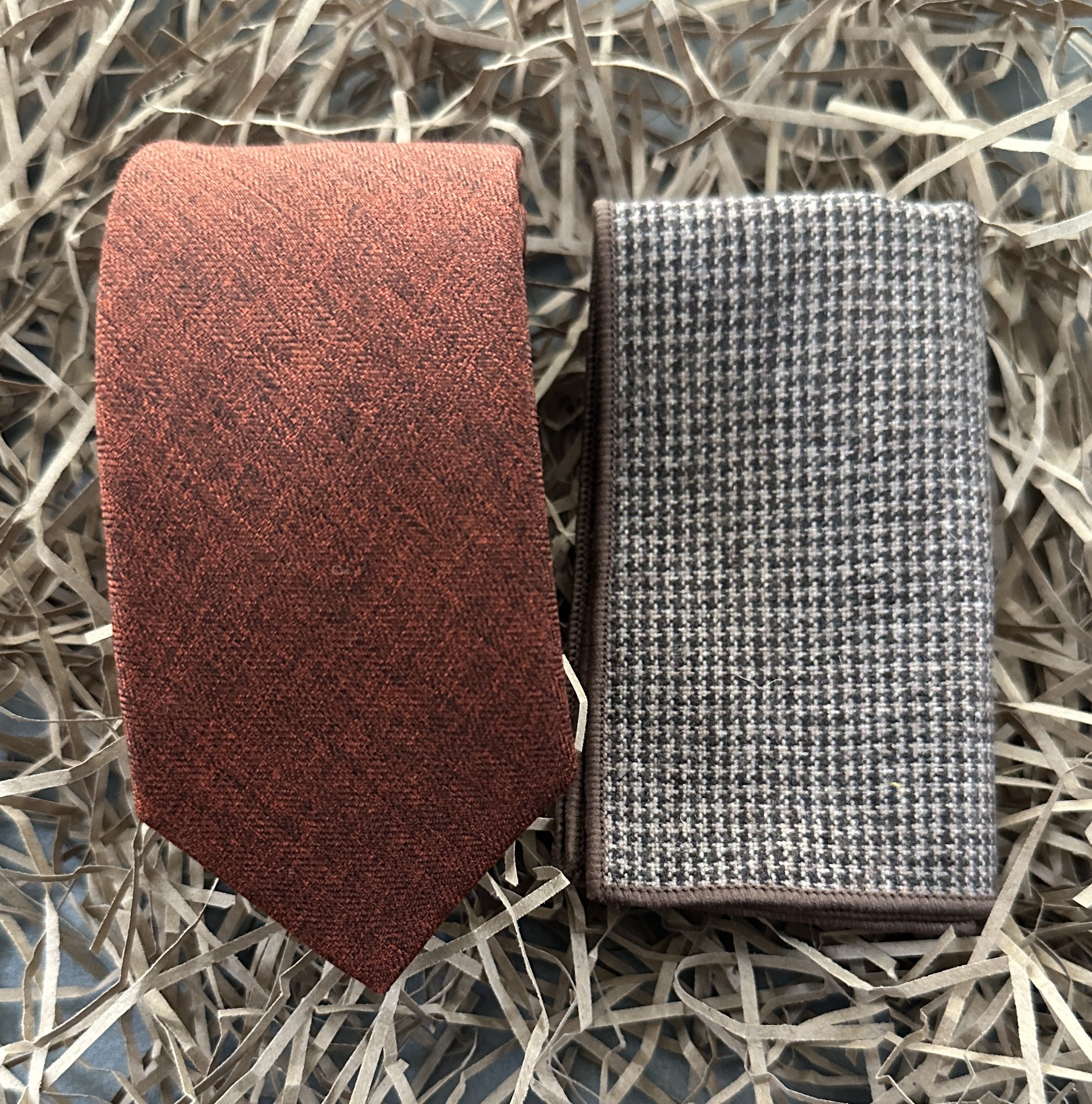 A burnt orange mens cotton tie and a check pocket square for mens ties, groomsmen gifts and wedding attire