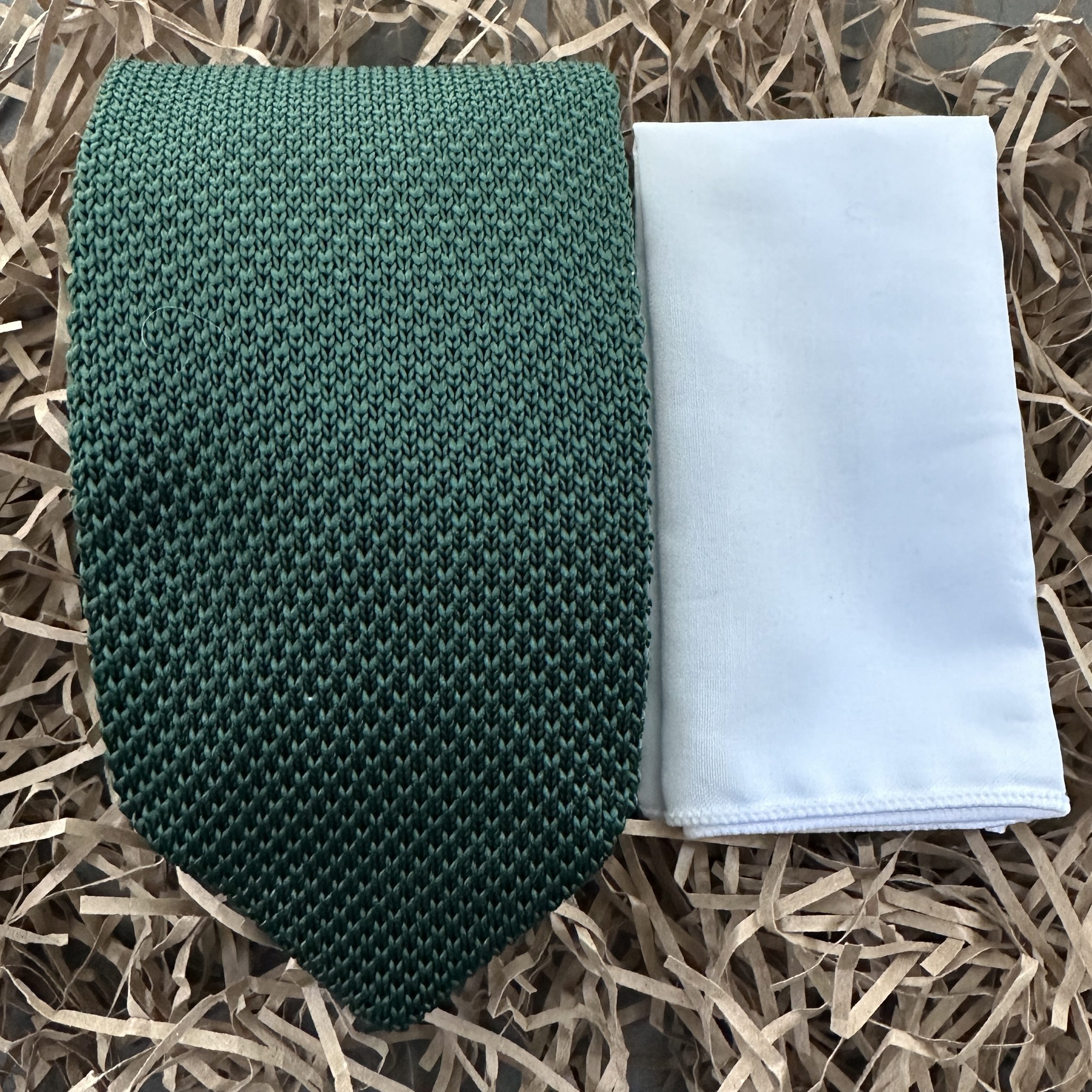 A green men's knitted necktie and white handkerchief for men's gifts, groomsmen gifts and wedding attire. The set comes with gift wrapping and so is ideal for men's gifts.