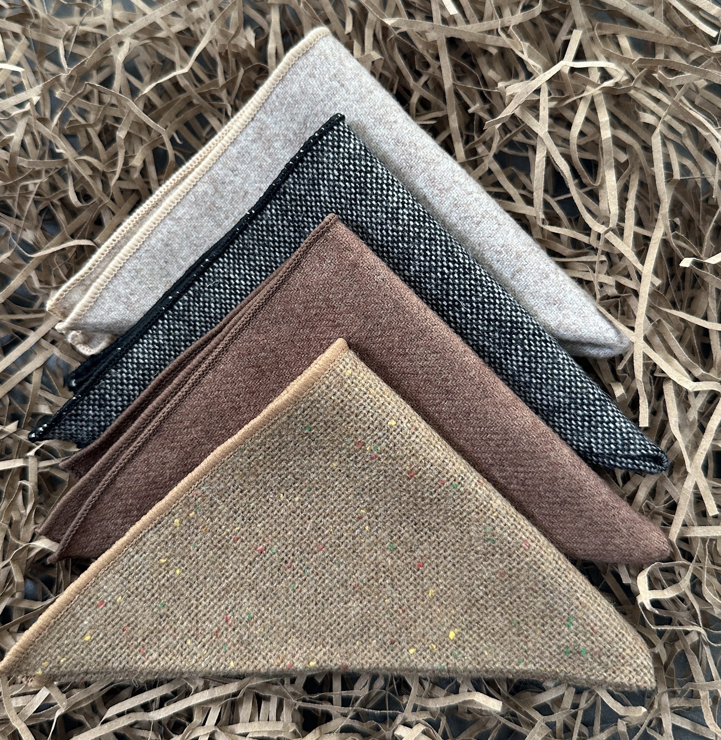A set of four mens pocket handkerchiefs in brown and grey wool ideal for men's gifts and groomsmen gifts.