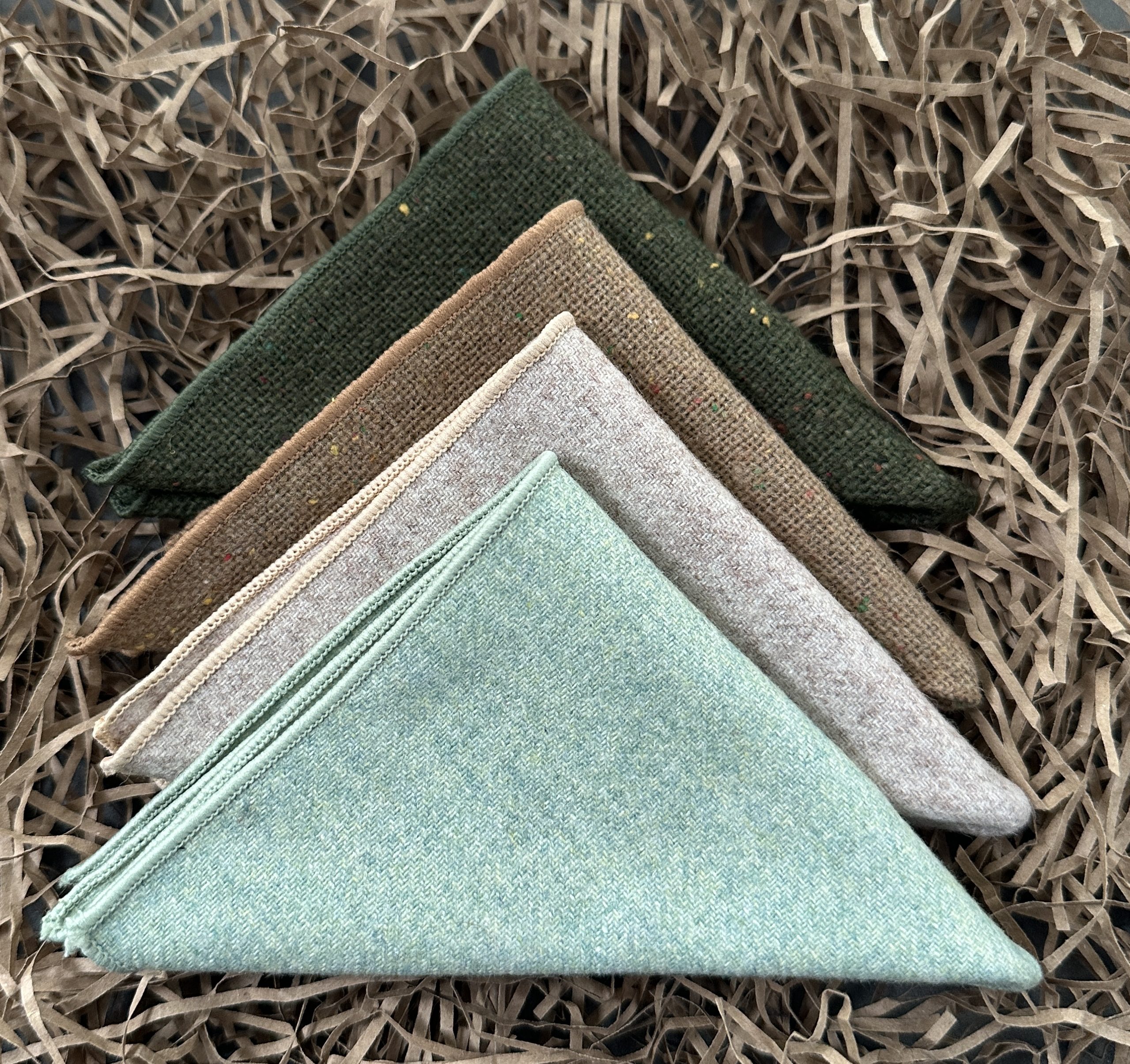A set of green wool pocket squares for mens gifts and unique groomsmen gifts.