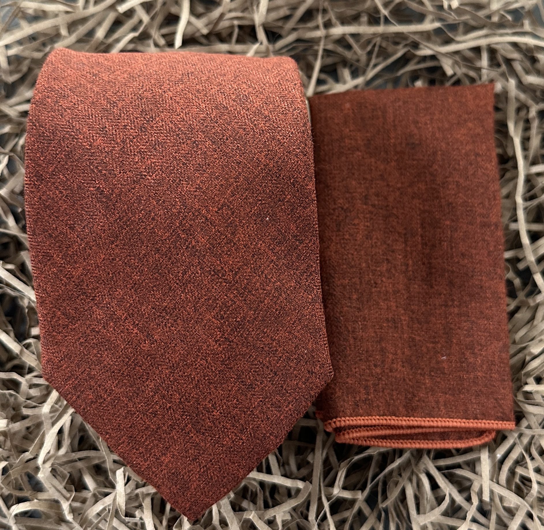 An orange brushed cotton tie and pocket square set ideal for wedding ties and graduation ties.